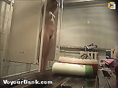 12 movies - Young slim doll getting spied after in the showers Part 1