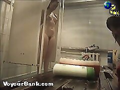 12 movies - Young slim doll getting spied after in the showers Part 2